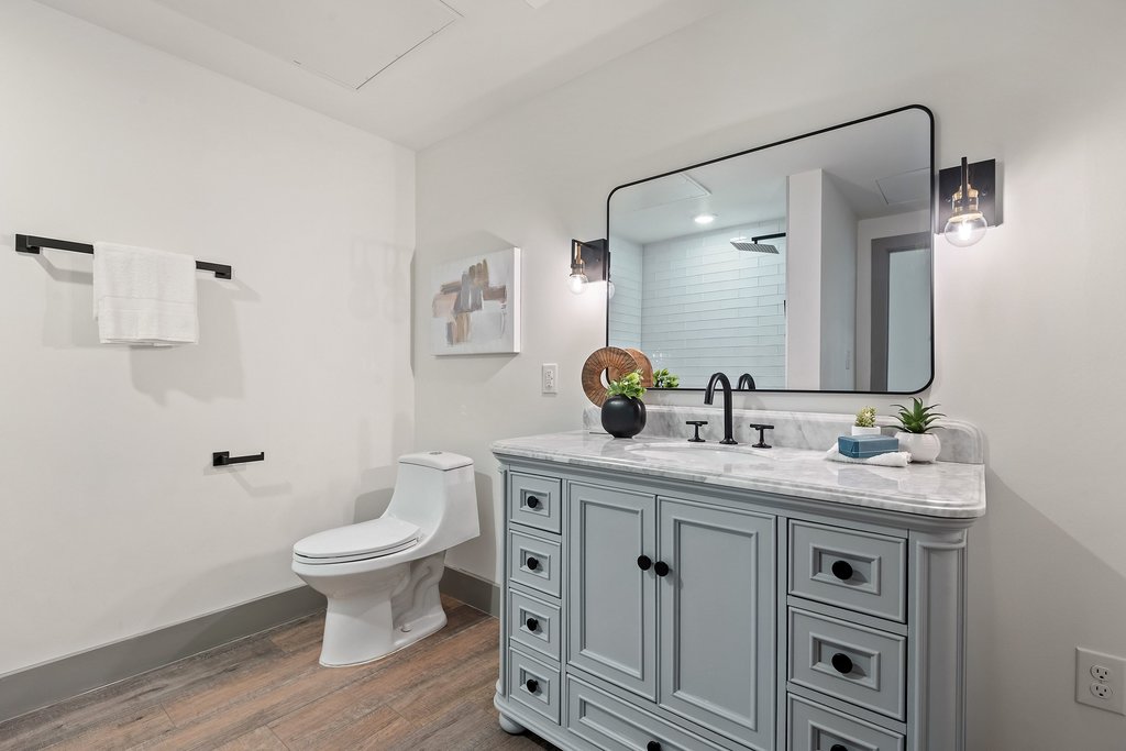 Trades workers relaxing in a well-furnished living room provided by CHC Rentals, highlighting the benefit of proper rest