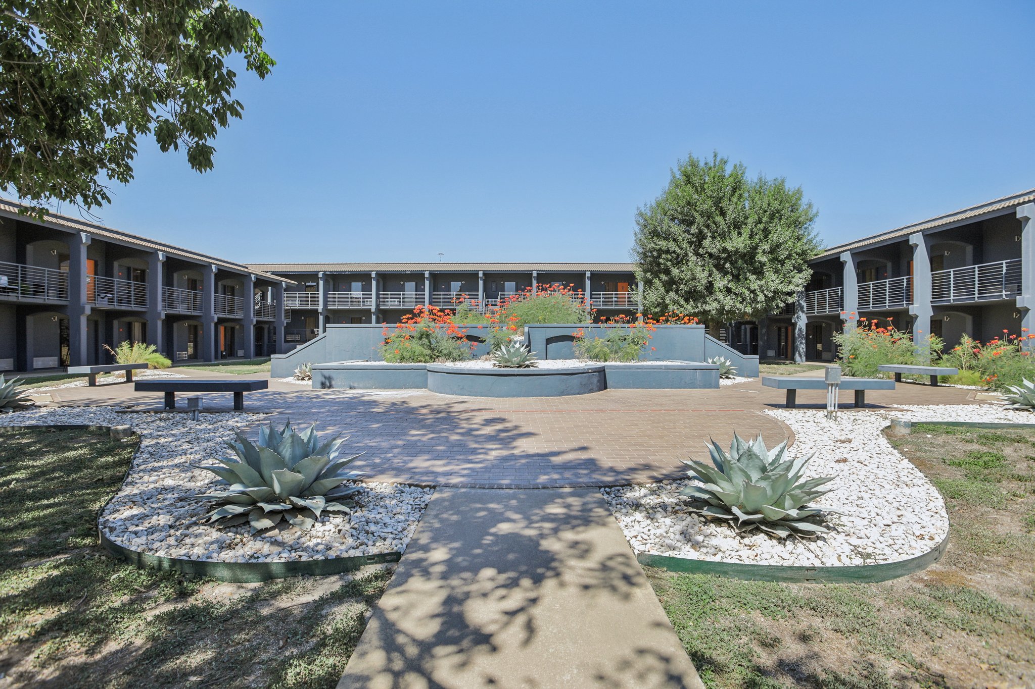 Executive preparing a presentation in the serene living area of a CHC Rentals corporate housing unit in Austin, TX