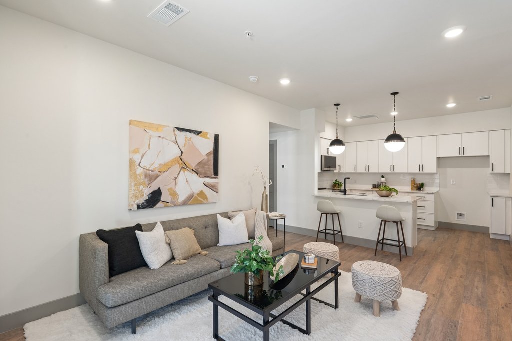 Traveling professional unpacking in furnished short-term rental before temporary assignment in Bryan
